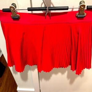 EUC Lululemon Varsity HR Pleated Tennis Skirt redish pink color
